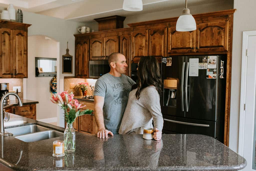 Husband and wife in the kitchen with coffee