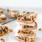 A stack of paleo magic cookie bars