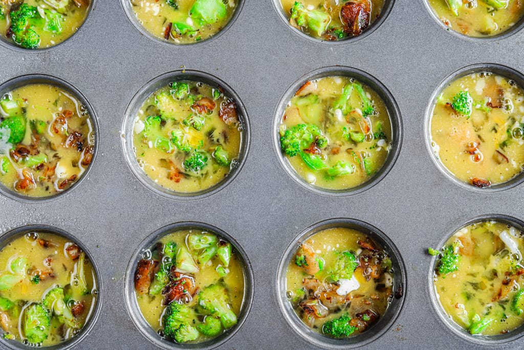 Bacon-carmelized-onion-and-broccoli-egg-bites-unbaked-in-a-muffin-tin