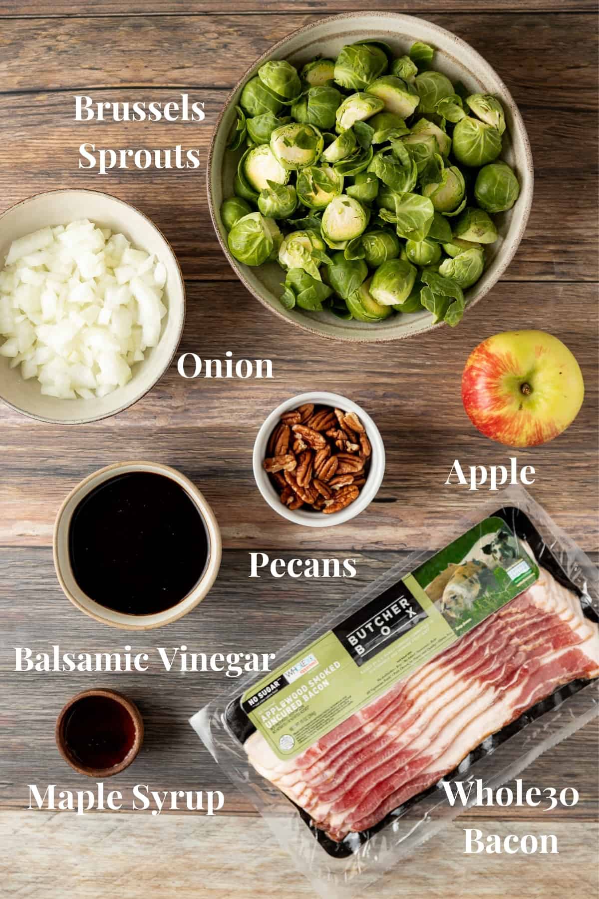 An overview shot of the ingredients needed for balsamic glazed brussels sprouts with apples and pecans