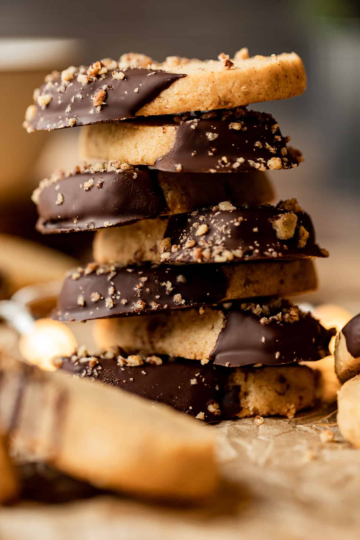 A stack of almond flour shortbread cookies that had been dipping in chocolate.