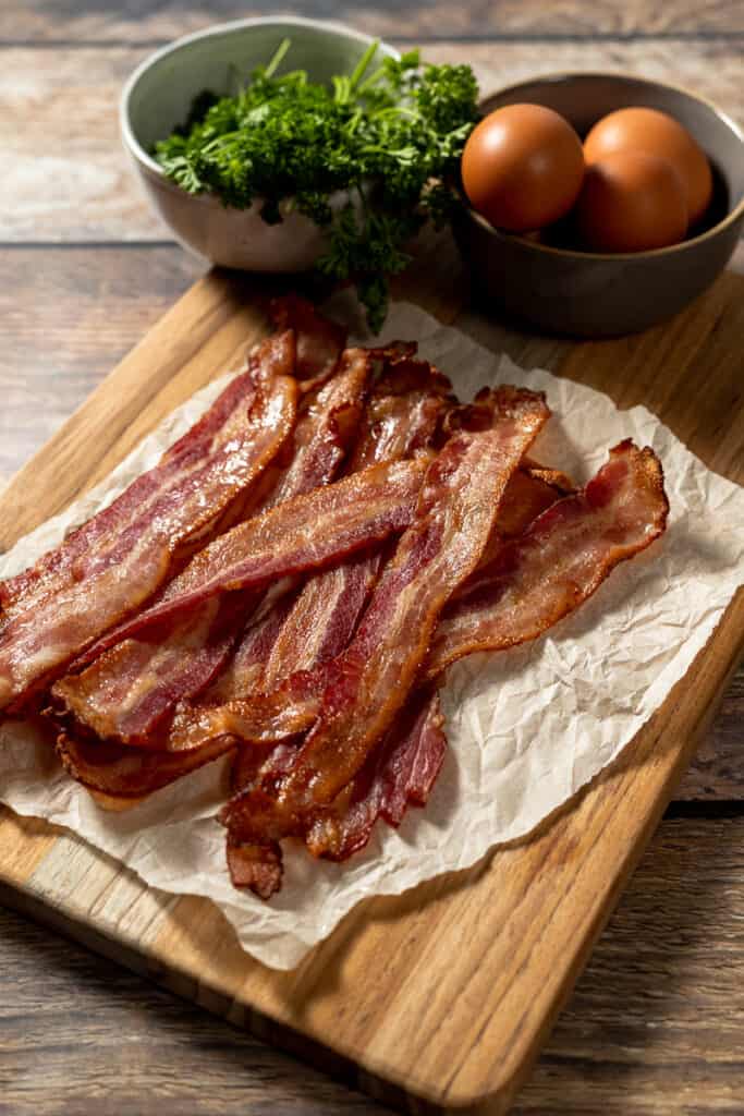Whole30 crispy bacon on a wood cutting board