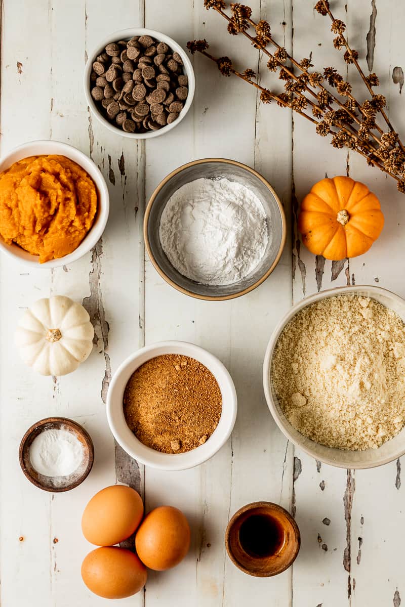 An overview shot of the ingredients needed for paleo pumpkin muffins with chocolate chips