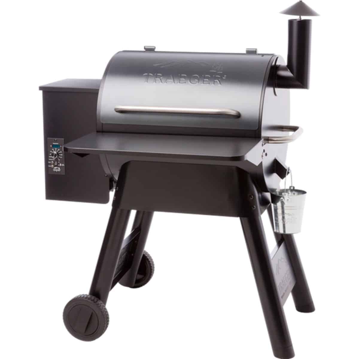 A traeger grill with an attached front shelf on a white background.
